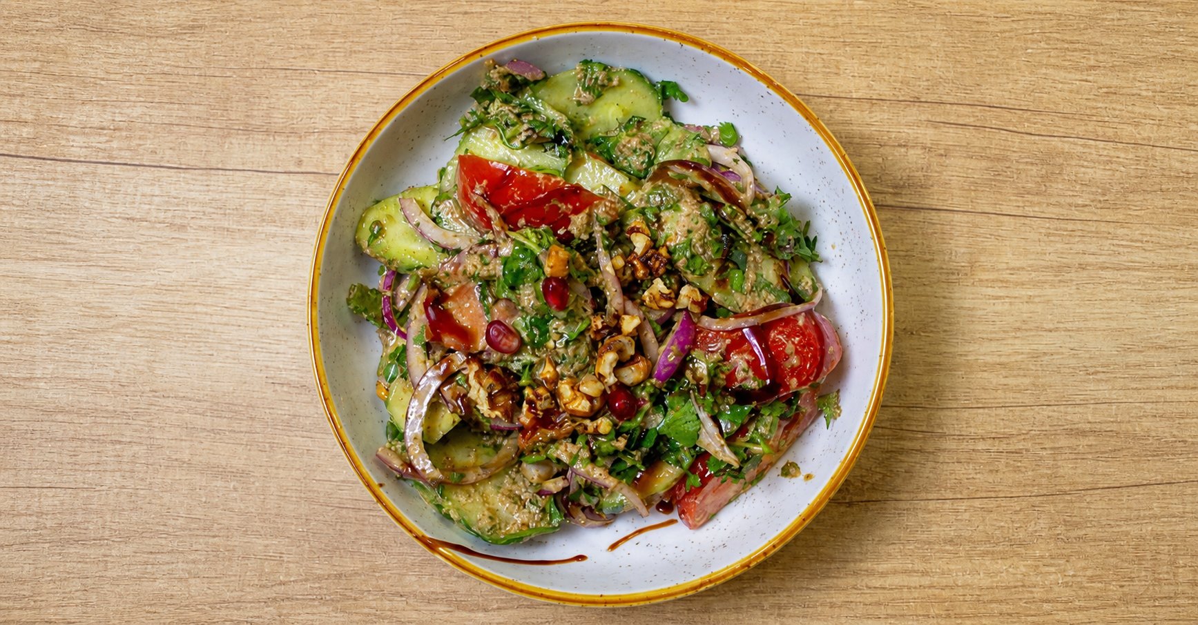 Georgian salad with walnut dressing and pomegranate